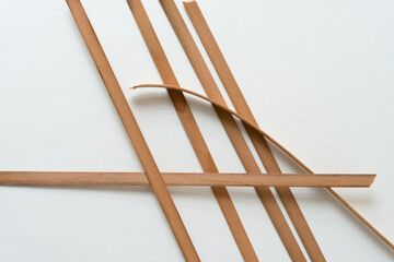 Canvas Print - vintage cedar wood straps on a white background