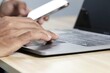 © Sai - Businessman using laptop and smartphone to work Contact the job online. Social media marketing concept.