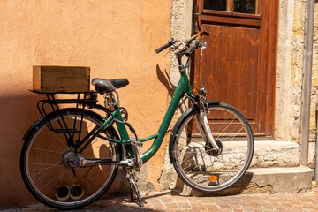 Wall Mural - Bicycle parked by the door of a house in Annecy, France