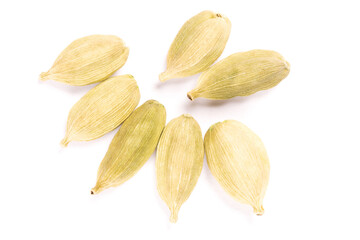 Wall Mural - Seven Spice green cardamom (Elettaria cardamomum) pods in bunch on white background isolated. Close up. Vegetarian food concept