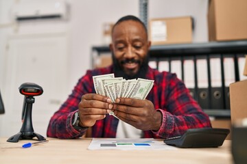 Sticker - Young african american man ecommerce business worker counting dollars at office