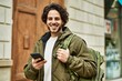 © Krakenimages.com - Handsome hispanic man using smartphone at the city