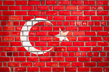 Wall Mural - National  flag of the Turkey on a grunge brick background.