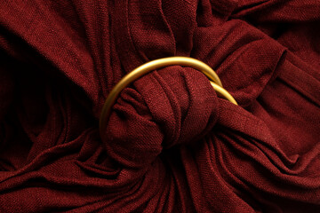 close up of red silk ring sling