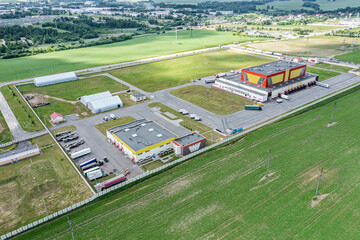Wall Mural - aerial panoramic view of industrial storage buildings in suburb area