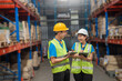 © onephoto - Female Manager in warehouse Shows Digital Tablet Information to chack Stock of Parcels with Products Ready for Shipment talking to Worker Loading Delivery