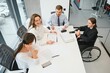 © Serhii - A group of business people partners during a set team meeting in the modern office. Teamwork concept