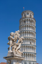 Italy, Tuscany, Pisa, Fontana Dei Putti Sculptures In Front Of Leaning Tower Of Pisa