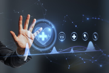 Wall Mural - Close up of businessman hand using creative polygonal medical interface hologram on blurry background. Online healthcare, cardiology and technology concept. Double exposure.