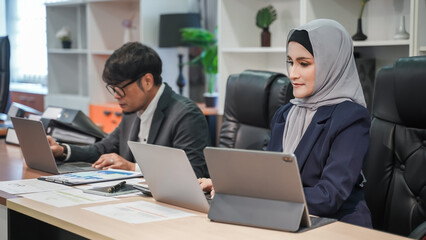 Poster - businessman  and woman use computer online  teamwork meeting discussion technology finance marketing digital analyst communication sitting coworker workplace looking desktop computer