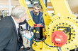© Westend61 - Senior customer getting advise on industrial robot from expert staff