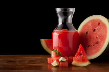 Close-up of organic fresh chilled Watermelon juice garnished with min leaf in studio light.