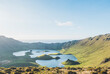 © Westend61 - Idyllic view of lake amidst hills on sunny day at Corvo Island, Azores, Portugal