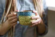 Hands Of Craftsperson Holding Ceramic Mug