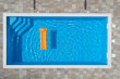 © Westend61 - Pool raft floating in swimming pool on sunny day