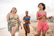 © Westend61 - Carefree multiracial women having fun at beach