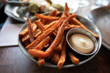 Bowl With Deep Fried Sweet Potato Chips Served With Mayonnaise Sauce