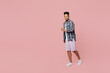 © ViDi Studio - Full body young smiling cheerful man of African American ethnicity he wear blue shirt walking going look camera isolated on plain pastel light pink background studio portrait People lifestyle concept