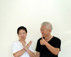 Wall Mural - Asian senior couple disagree to each other conflict in relationship life