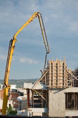 Canvas Print - building an apartment building, construction workers are working hard