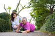 © Prot - Asian senior woman fell down on lying floor because faint and limb weakness and Crying in pain form accident and her daughter came to help support. Concept of old elderly insurance and health care