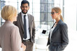 © ty - Group of business partners discussing ideas and planning work in office.
