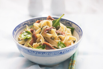 Wall Mural - Fresh pasta with spinach, olive oil, anchois and capers