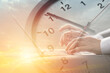 © Quality Stock Arts - Business working times concept people work typing on laptop computer overlay with in time clock to lunch break