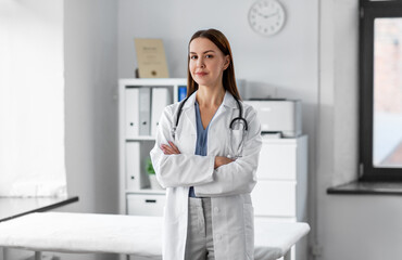 Wall Mural - medicine, healthcare and profession concept - female doctor with stethoscope at hospital