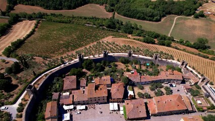 Poster - Aerial drone view of fortified medieval town and castle Monteriggioni in Tuscany, Siena province, Italy