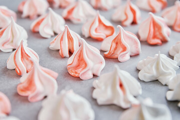 Process of making homemade meringue, woman cooking sweet cream for dessert on baking sheet