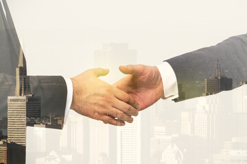 Handshake of two businessmen on modern cityscape background, deal and trading concept. Multiexposure