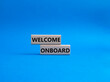Welcome onboard symbol. Concept words Welcome onboard on wooden blocks. Beautiful blue background. Business and Welcome onboard concept. Copy space.