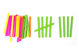 Fototapeta  - counting colorful sticks for the purposes of early education, development, learning to count and play. Banner with colored sticks on isolated white background