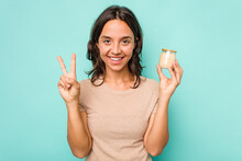 Young Hispanic Woman Holding Yogurt Isolated On Blue Background Showing Number Two With Fingers.