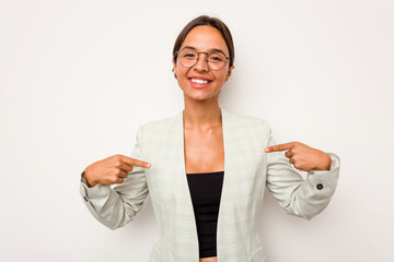 Poster - Young hispanic woman isolated on white background points down with fingers, positive feeling.