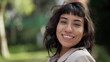 © Marco - A hispanic woman with indigenous traits smiling at camera. Portrait face closeup of South American person