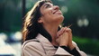 A grateful hispanic woman praying to God with hands clenched looking at sky smiling. Spiritual person having HOPE