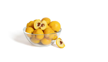 Wall Mural - Quince in a transparent bowl isolated on a white background. Yellow ripe fruit. Copy space. Fresh organic food.