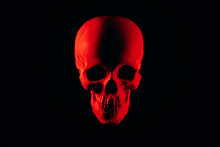 Human Skull With Red Backlight On Black Background