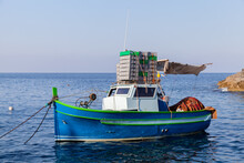 Small Fishing Boat Anchored In Port