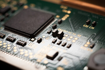 Canvas Print - Macro photo of a green computer printed circuit board with selective focus on an blank chip. Concept photo. Microchip manufacturing in Taiwan.