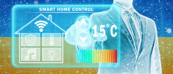 Frozen citizen of Ukraine adjusting heating temperature on a virtual screen of smart home controller, winter blizzard. Concept of forced thrift, energy war and increased price for natural gas