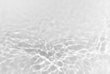 Fototapeta Kwiaty - Water texture with sun reflections on the water overlay effect for photo or mockup. Organic light gray drop shadow caustic effect with wave refraction of light. Banner with copy space