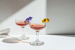 © Sophia Hsin/Stocksy - Juicy cocktail drinks with flowers and sunlight