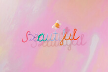 On A Colorful Background, The Word "beautiful" And Around It