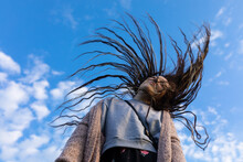 Girl Blowing Her Hair In The Wind