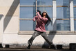 © Bo Bo/Stocksy - young woman hip hop dance on the roof