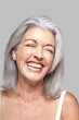 © Trinette Reed/Stocksy - Close-up portrait of mature woman laughing
