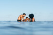 © Alison Winterroth/Stocksy - Siblings kiss at the beach
